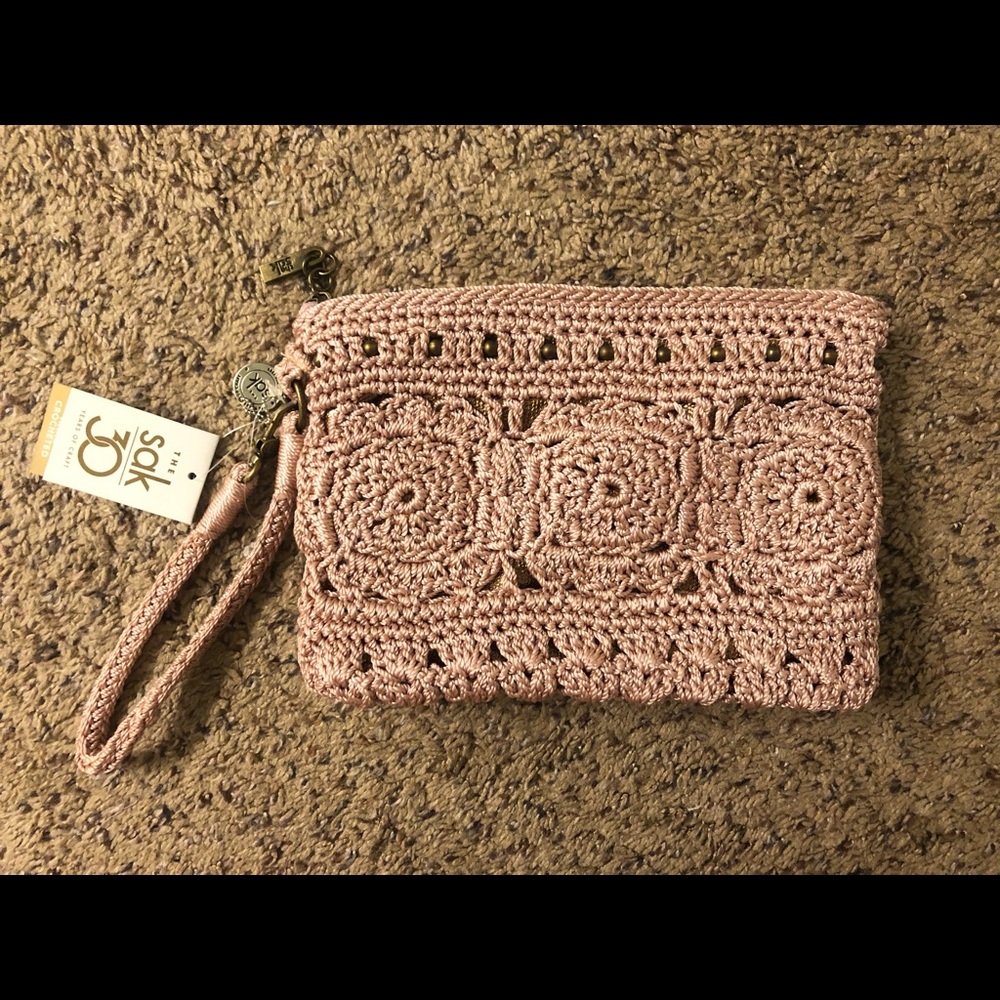 The Sak Hand Crocheted pink clutch